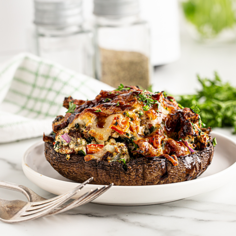Air fryer stuffed portobello mushrooms filled with savory ingredients, golden and crispy."