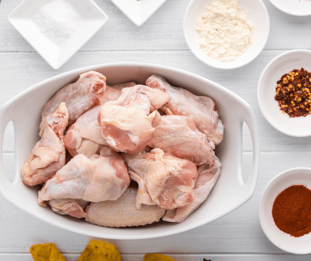 Step-by-step preparation of Air Fryer General Tso's Chicken Wings, showcasing the ingredients laid out on a countertop.