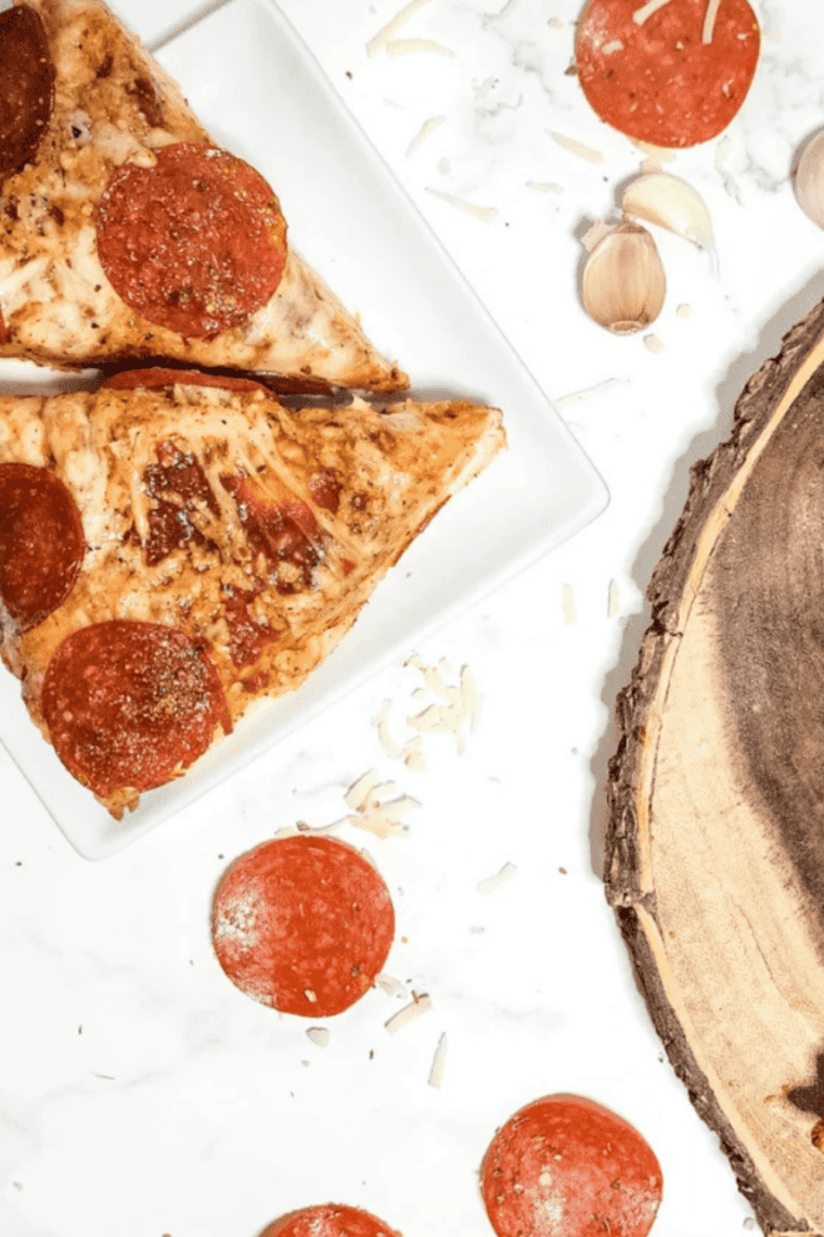 Homemade Easy Little Caesar’s Pizza Sauce in a bowl with a spoon