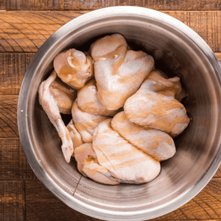 Create the marinade for the chicken wings in a large mixing bowl.
