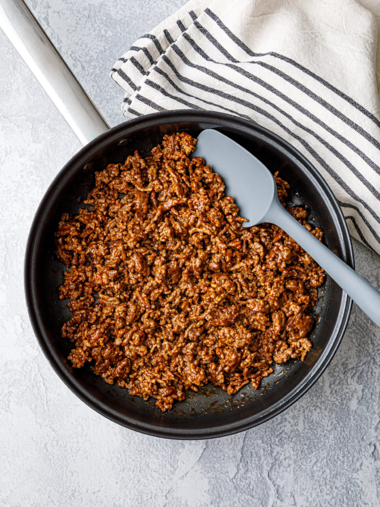 Saute the ground beef in a large skillet.