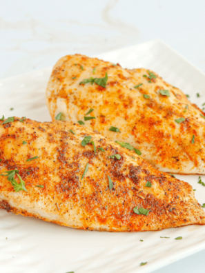 Juicy, perfectly cooked air fryer butterflied chicken breast served on a plate
