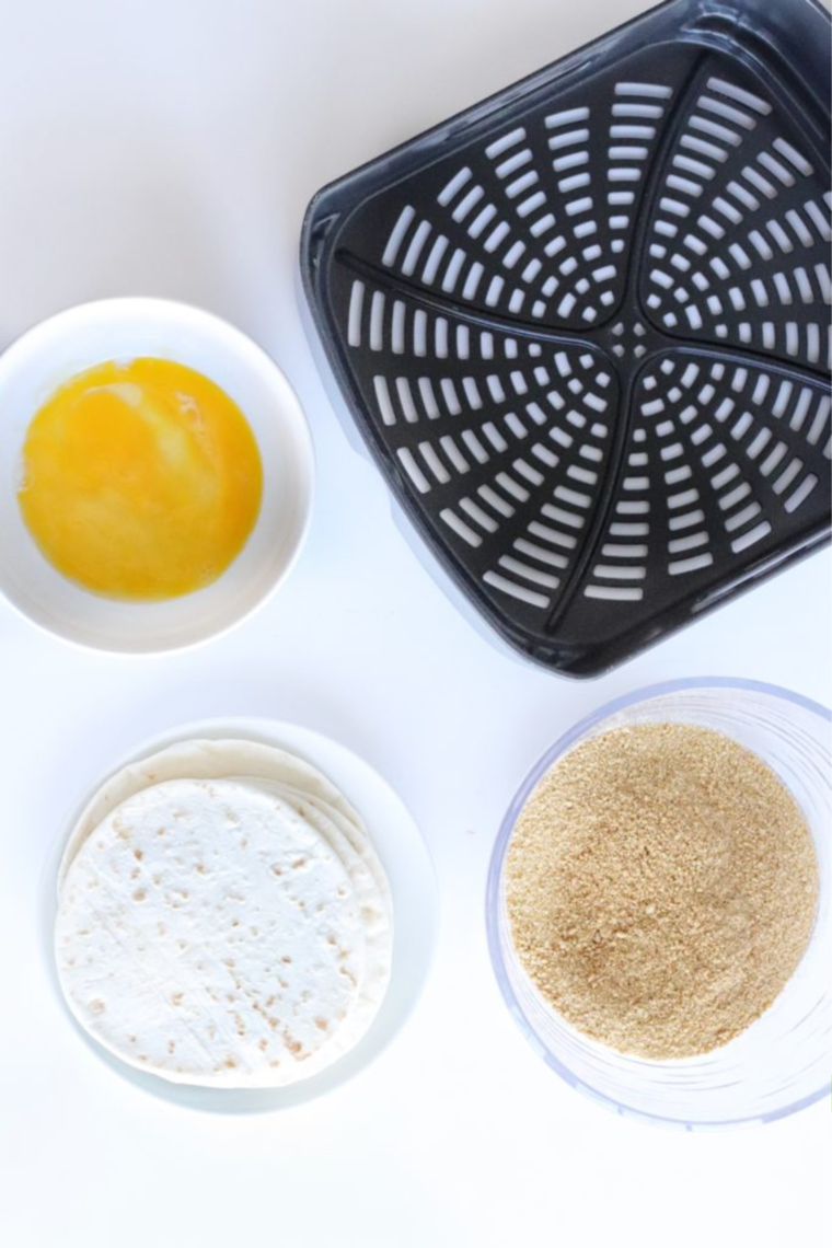 Cheesecake filling ingredients blended in a food processor for strawberry dessert tacos
