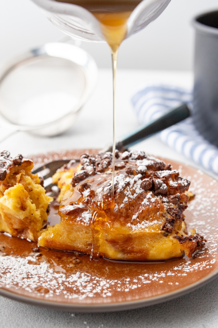 Air fryer chocolate chip French toast casserole with golden baked bread and melted chocolate chips on top