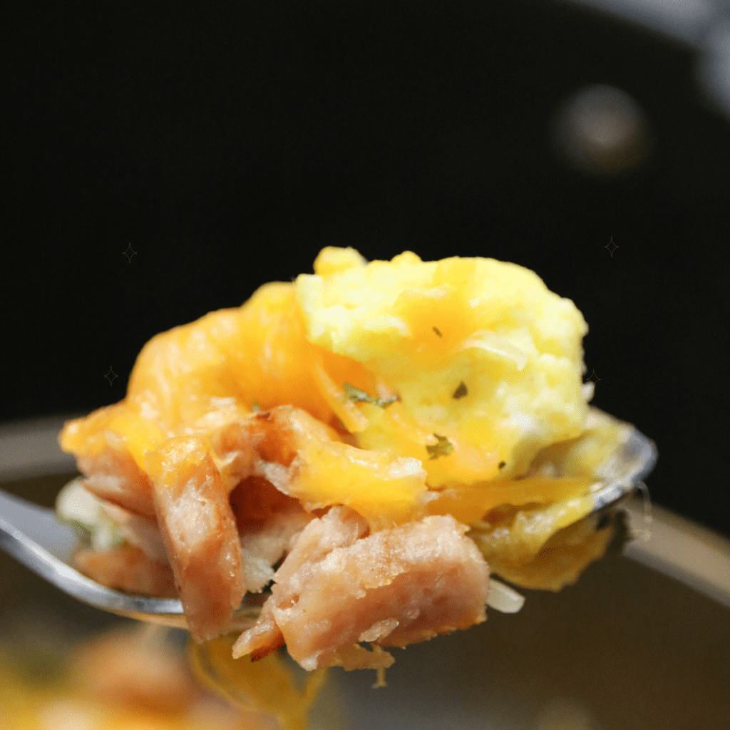 Air fryer country spam and eggs served hot with crispy spam pieces and fluffy scrambled eggs.