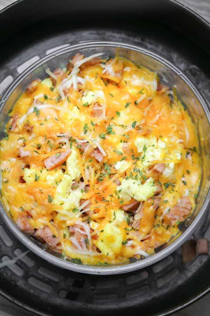 Crispy Air Fryer Spam cubes with fluffy scrambled eggs served on a plate, ready to eat.