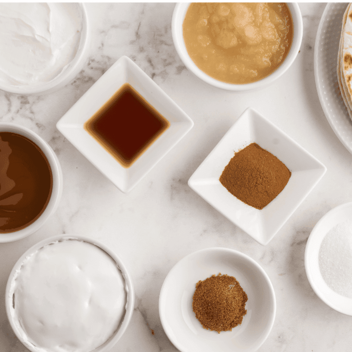 Ingredients needed for Cinnamon Salted Caramel Sauce on kitchen table.