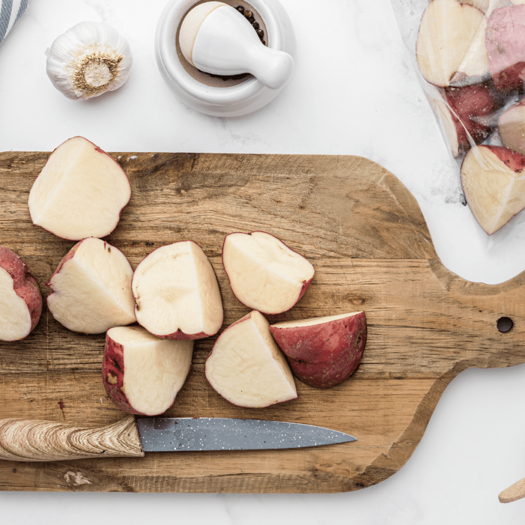 Preheat the air fryer to 400°F (200°C) for a few minutes. In a large mixing bowl, combine the halved baby potatoes with olive oil, garlic powder, onion powder, paprika, salt, and pepper. Toss until the potatoes are evenly coated with the seasonings. Place the seasoned potatoes in a single layer in the air fryer basket. Air fry the potatoes at 400°F (200°C) for 15-20 minutes, shaking the basket halfway through the cooking time to ensure even cooking. The potatoes should be golden brown and fork-tender when done. Once the potatoes are cooked, remove them from the air fryer and let them cool slightly.