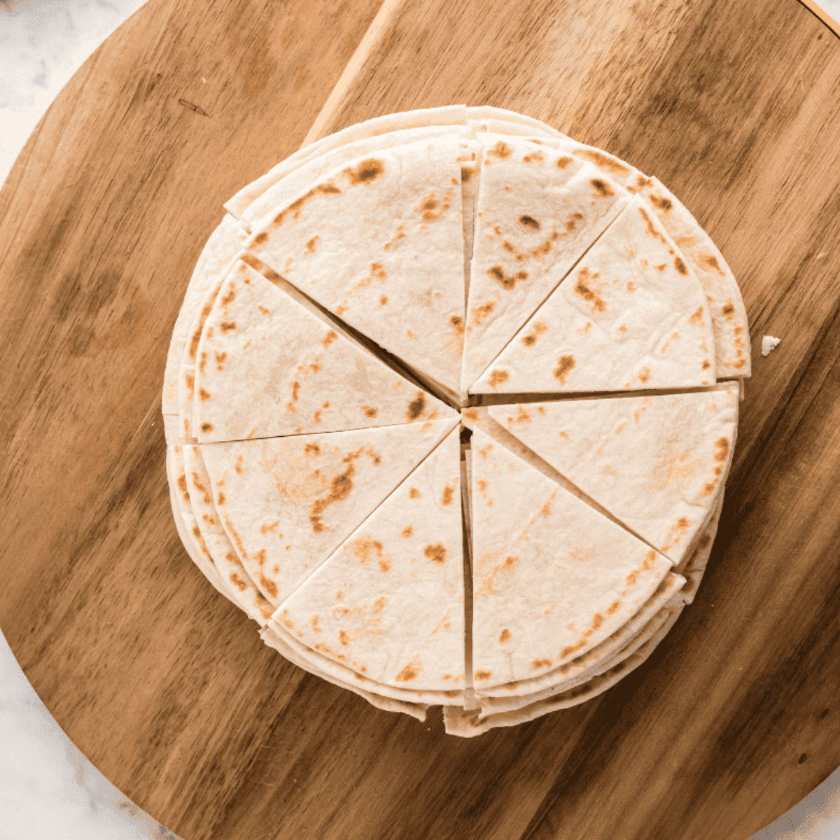 Cut the tortillas into wedge shapes.