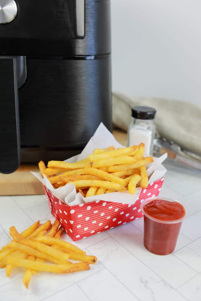 A plate of perfectly cooked air-fried Ore-Ida Extra Crispy Fast Food Fries.