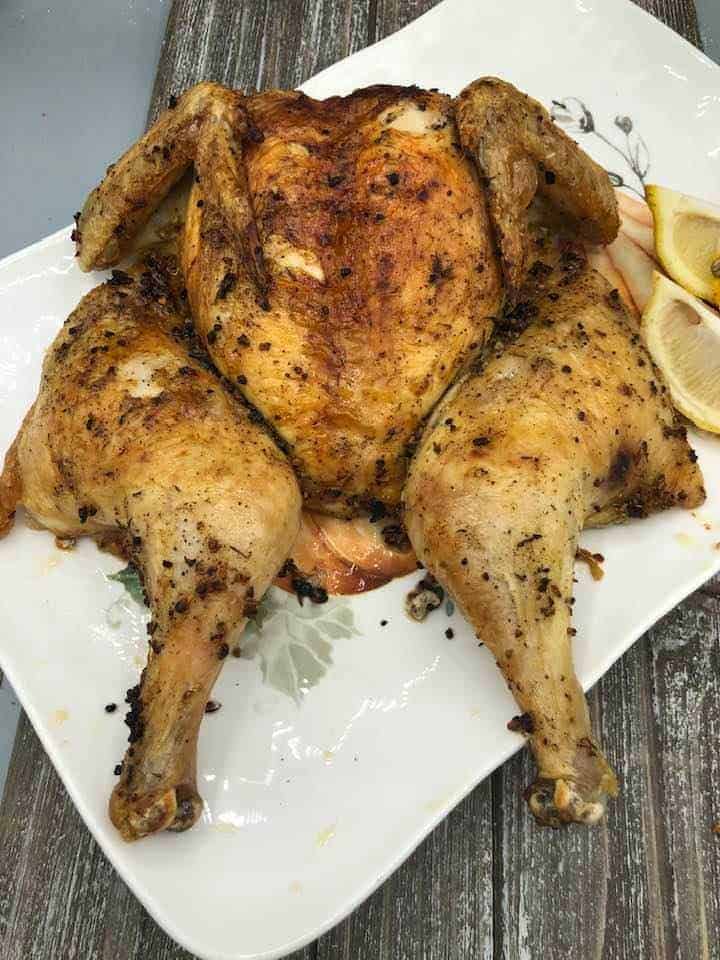 Trader Joe’s spatchcock chicken roasted to perfection, golden and crispy on the outside, served with fresh herbs and vegetables.