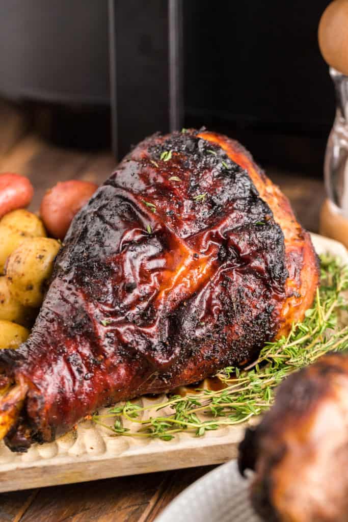 How Do I Know When Turkey Is Done?
Testing the internal temperature is the only way to tell if the air fryer turkey leg is done. It should be 180 degrees F. Try this using an instant-read thermometer which you must stick in the thickest part of the turkey leg.
What Do Turkey Legs Taste Like?
Turkey legs are a flavorful and juicy cut of dark meat with a taste that is often described as rich, savory, and slightly sweet. The meat has a firmer texture than chicken and is darker in color due to the higher levels of myoglobin, a protein that helps store oxygen in muscles.
Turkey meat is one of the most popular parts of the turkey and a great alterative to the Thanksgiving Turkey!
How To Get Crispy Air Fryer Turkey Legs
Getting crispy skin on turkey legs when air frying can be a challenge, but there are some tips you can follow to help achieve that perfect crispy texture. Here are some things to keep in mind:
Pat the turkey legs dry: Dry turkey legs before seasoning them. Dry them with paper towels to remove the excess moisture from the turkey legs.
Use a high temperature: Preheat the air fryer to a high temperature, around 375°F (190°C) or higher. This will help the skin crisp up faster.
Brush with oil: Brushing the turkey legs with a small amount of oil, such as vegetable or olive oil, can help the skin crisp up and brown evenly. You can also brush melted butter over the turkey legs, giving you a deep golden brown color.
Don't overcrowd the basket: Make sure the turkey legs are not overcrowded in the air fryer basket, as this can prevent the skin from crisping up.
Flip the turkey legs: Flip the turkey legs halfway through cooking to ensure that both sides of the skin are evenly crisped.
Use a rack: Place the turkey legs on a wire rack in the air fryer basket if possible. This will allow air to circulate the turkey legs and help the skin crisp.
Finish under the broiler: If the skin is not as crispy as you'd like it to be after air frying, finish the turkey legs under the broiler for a few minutes to achieve a crispy and golden-brown skin.
Following these tips, you can achieve crispy and delicious turkey legs in the air fryer.