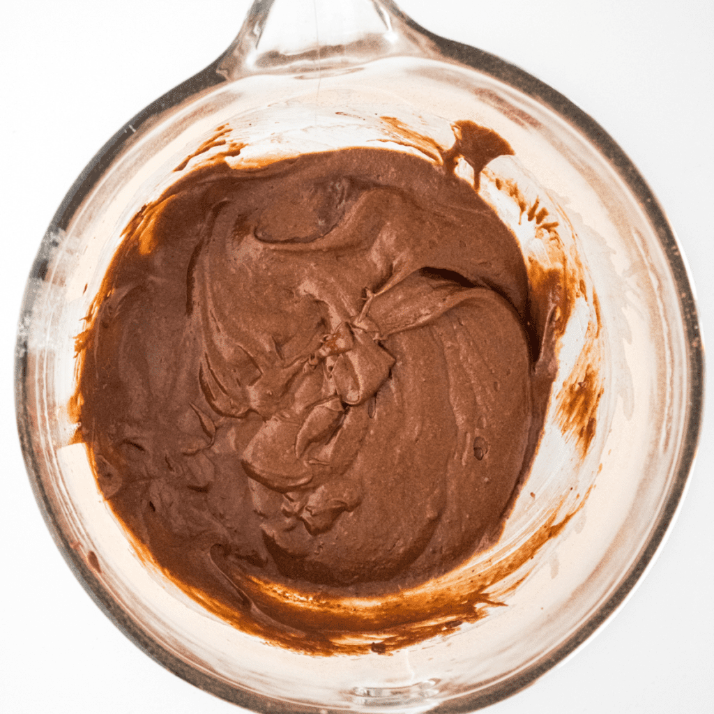 Mixing Nutella brownie batter in a bowl until smooth