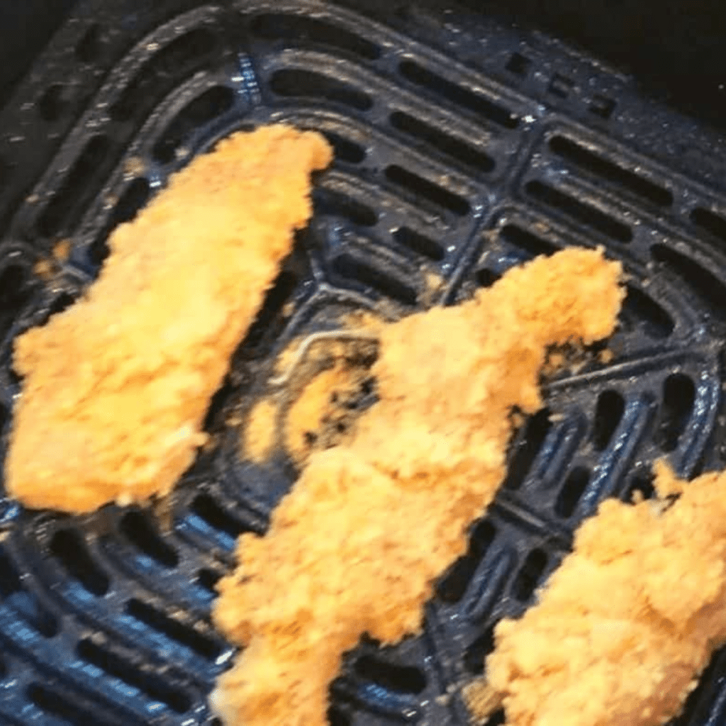 Place  Cornflake Chicken Tenders in the air fryer basket.