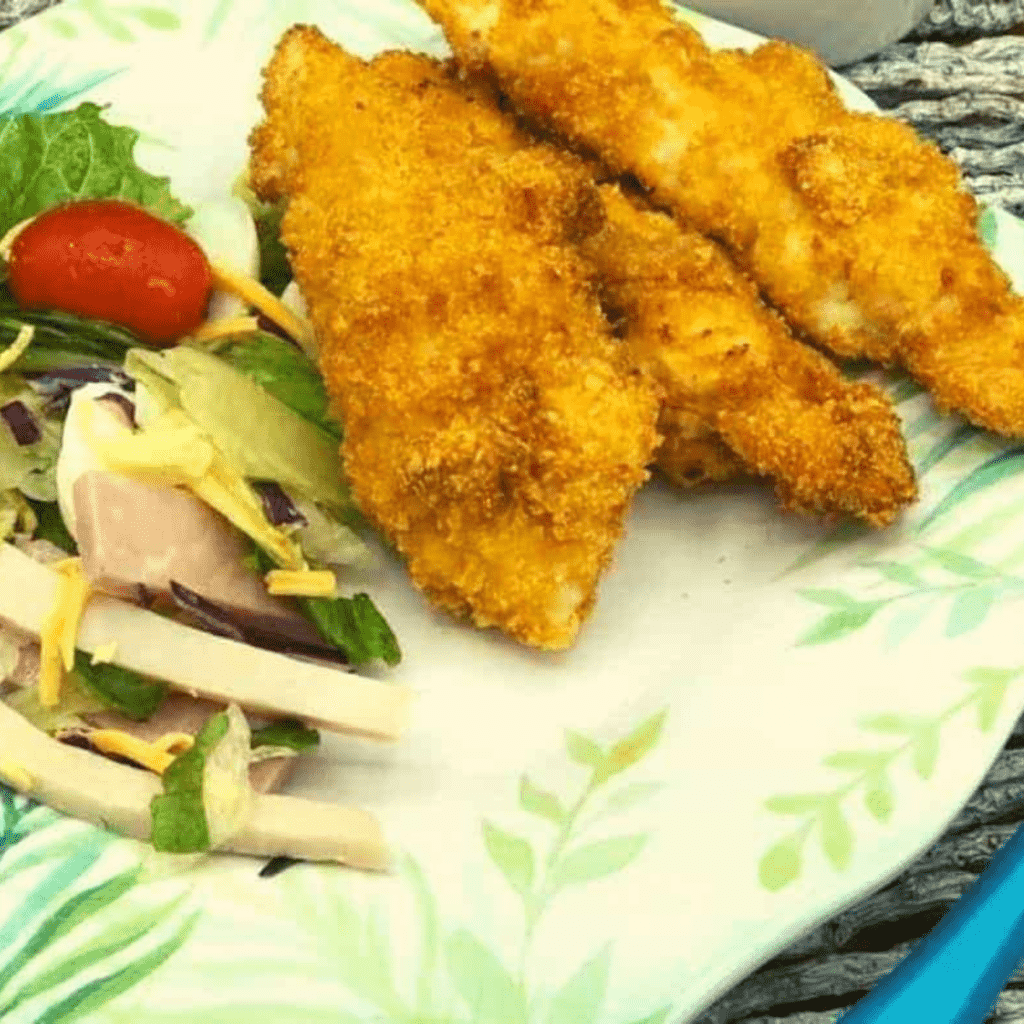 Golden, crispy Air Fryer Cornflake Chicken Tenders, coated in cornflakes for a healthier, crispy finish, perfect for a quick and tasty meal.