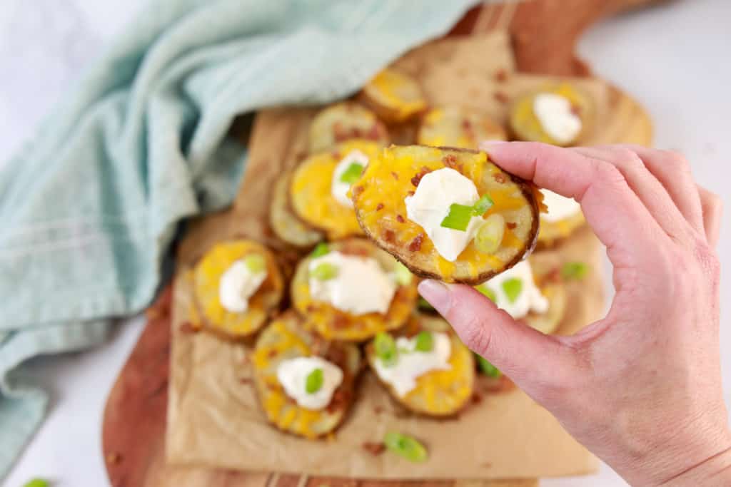  Serving crispy air fryer potato rounds with dipping sauce."