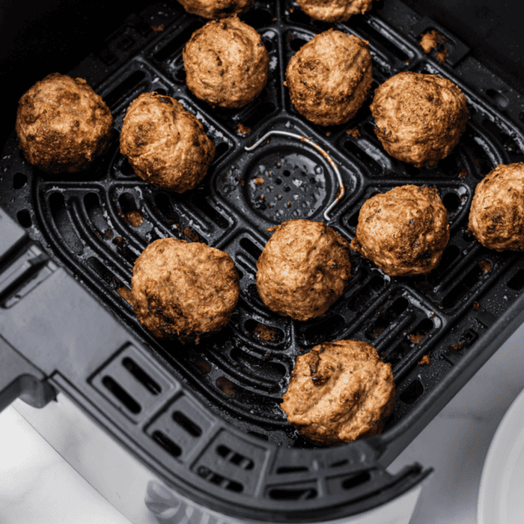 Juicy air fryer lamb meatballs garnished with fresh herbs