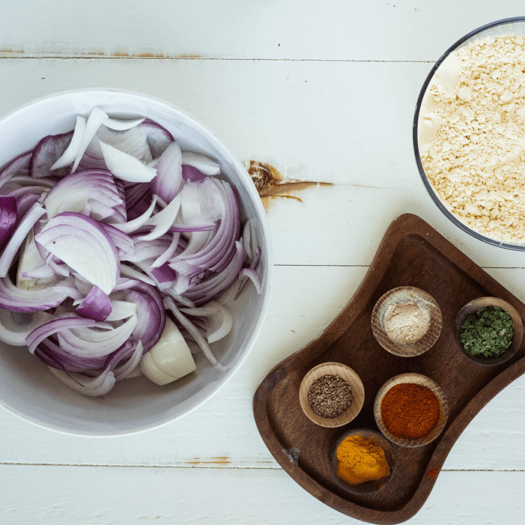 Ingredients Needed For Air Fryer Pakora Recipe on wooden table.