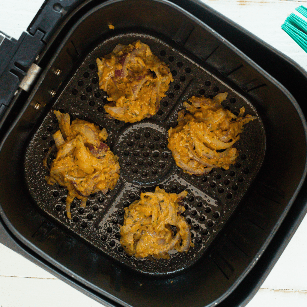 Place Air Fryer Onion Pakora in the air fryer basket.