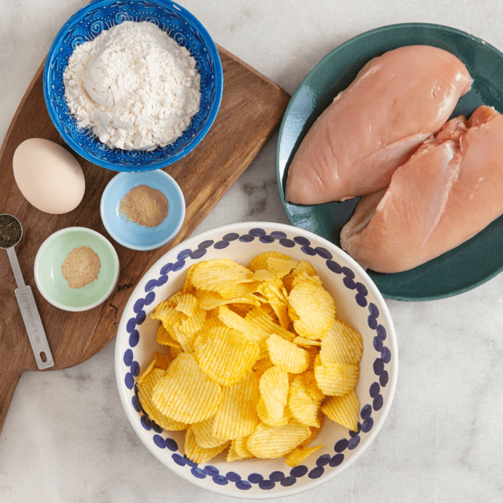 Ingredients Needed For Air Fryer Potato-Crusted Chicken on kitchen table.