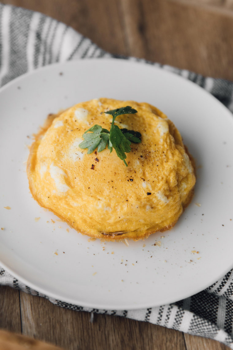 Sliced air fryer Spanish tortilla showing a soft center and crisp golden edges