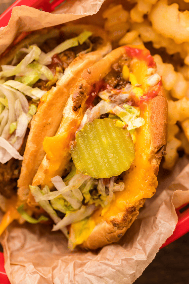 "Delicious Air Fryer Taco Burgers with melted cheese, ground beef, and taco bun shells."