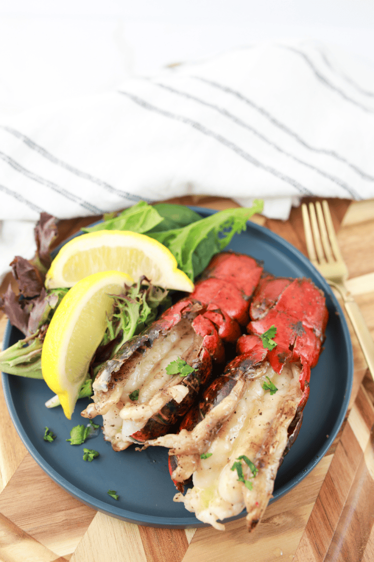 Tender lobster tails seared on a Blackstone Griddle and topped with seasoned butter and parsley.