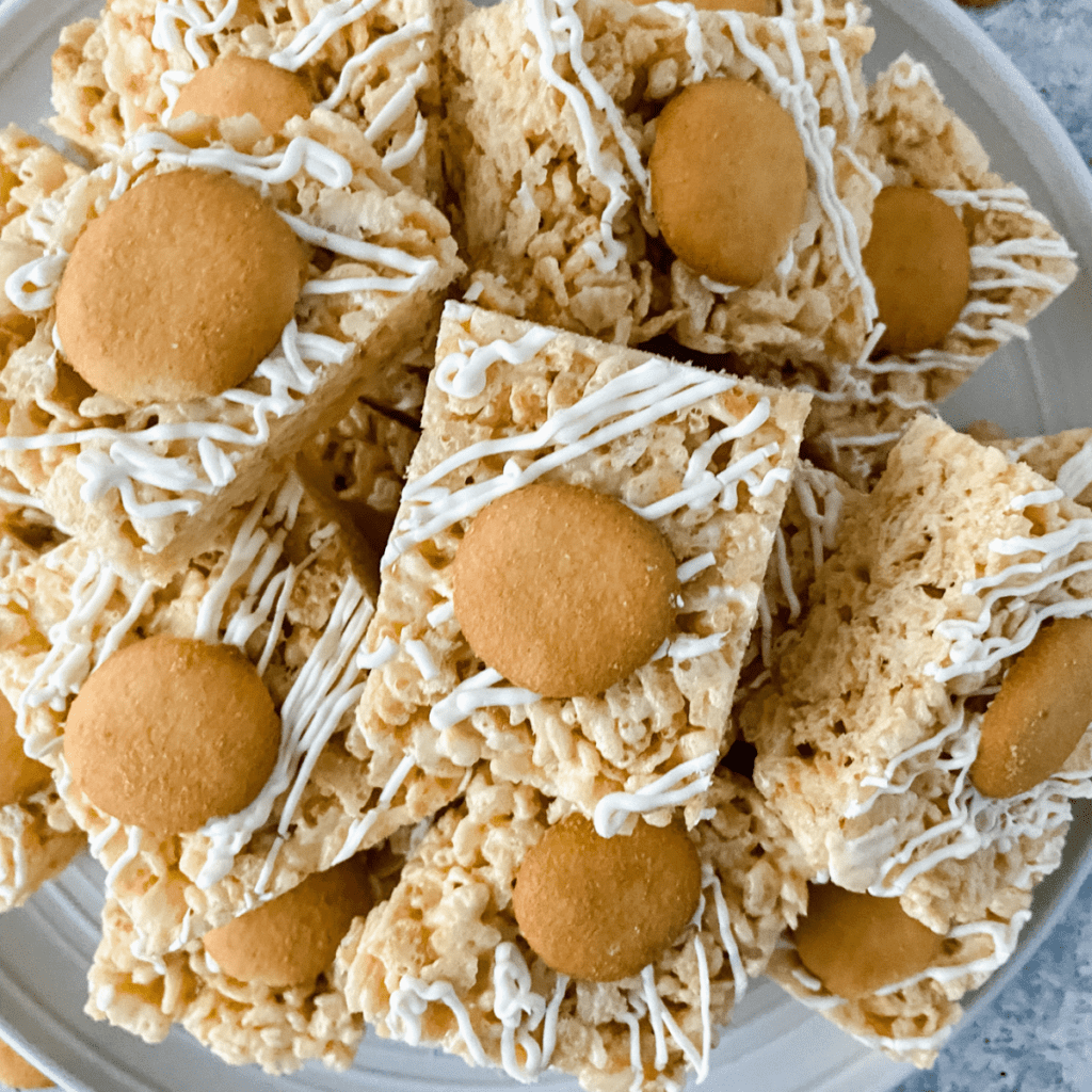 Letting the layered Rice Krispie treats firm up for 20–30 minutes before slicing.