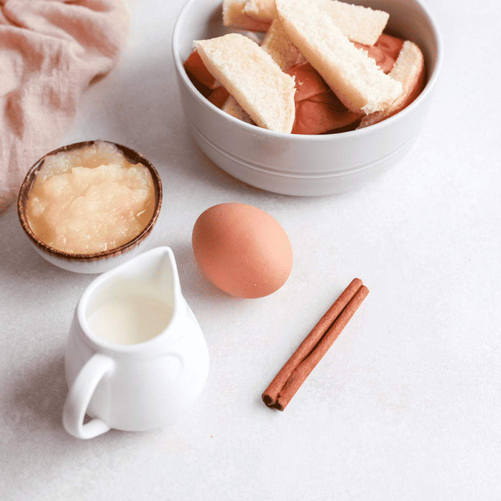 Ingredients needed for Easy Air Fryer Apple French Toast Sticks on kitchen table.