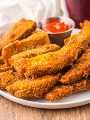 Copycat Buffalo Wild Wings potato wedges tossed in buffalo sauce, served with blue cheese dressing