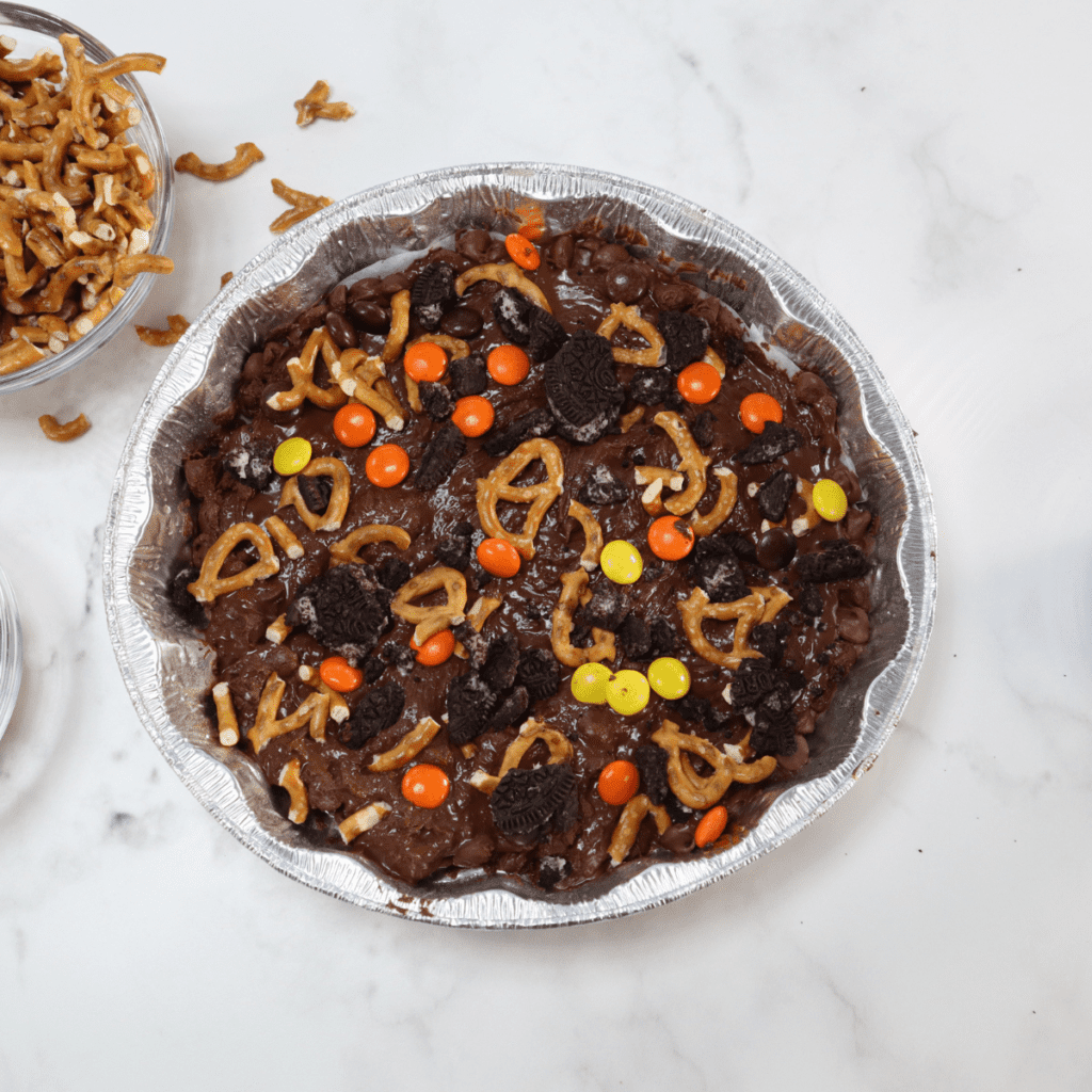 Add the toppings to the chocolate candy.
