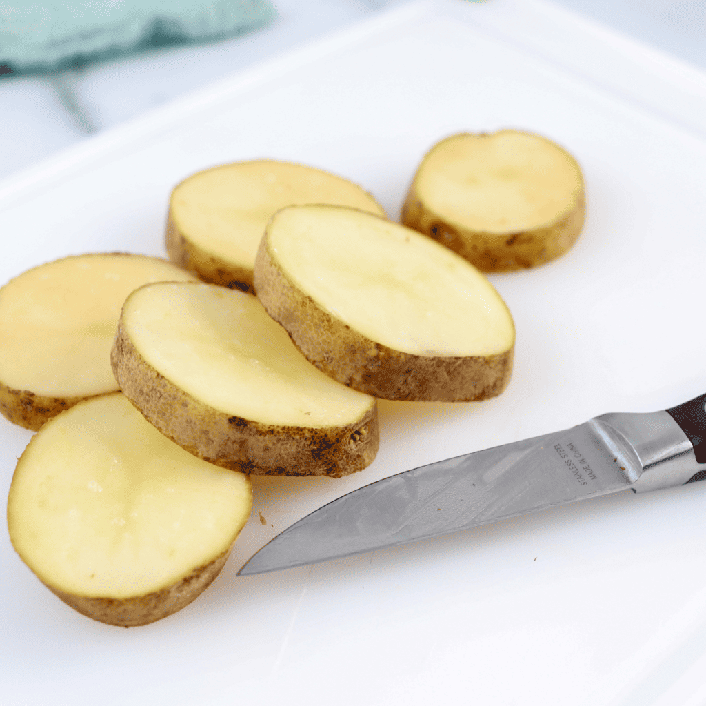Chopped potatoes on cutting board.