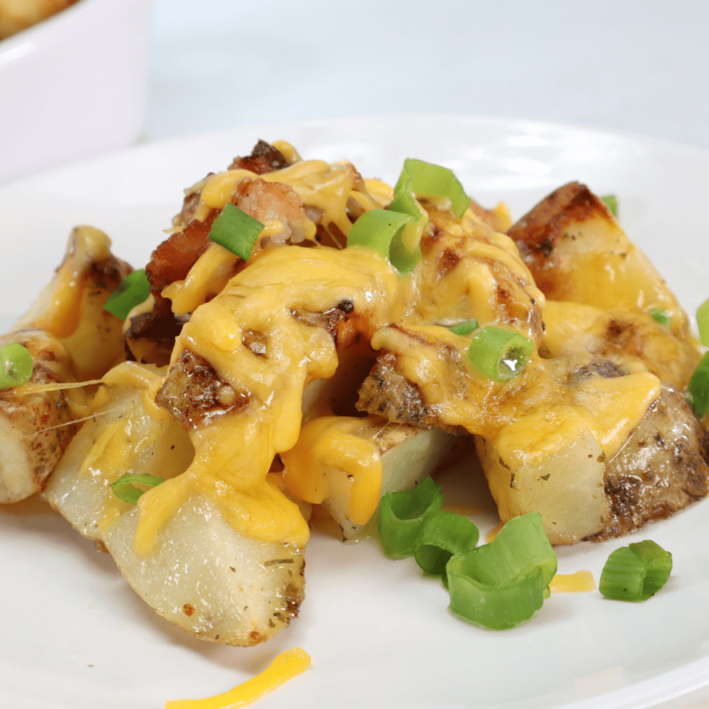  Air frying potatoes and bacon at 350°F until crispy, then topping with cheese and letting it melt with residual heat in the air fryer