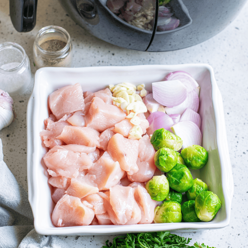 Ingredients needed for Easy Air Fryer Chicken and Brussels Sprouts on kitchen table.