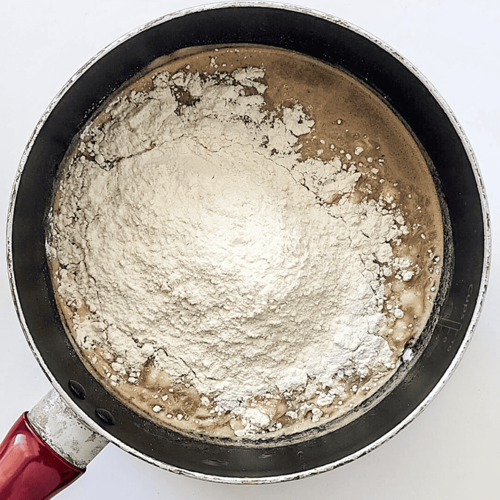 Mixing water, butter, salt, and cinnamon in a pot, heating until boiling, adding flour, and stirring to form dough for churros.