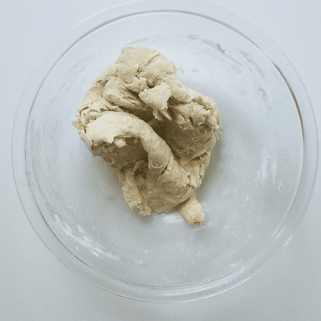 Bowl of yeast mixture, forming the basis of the dough.