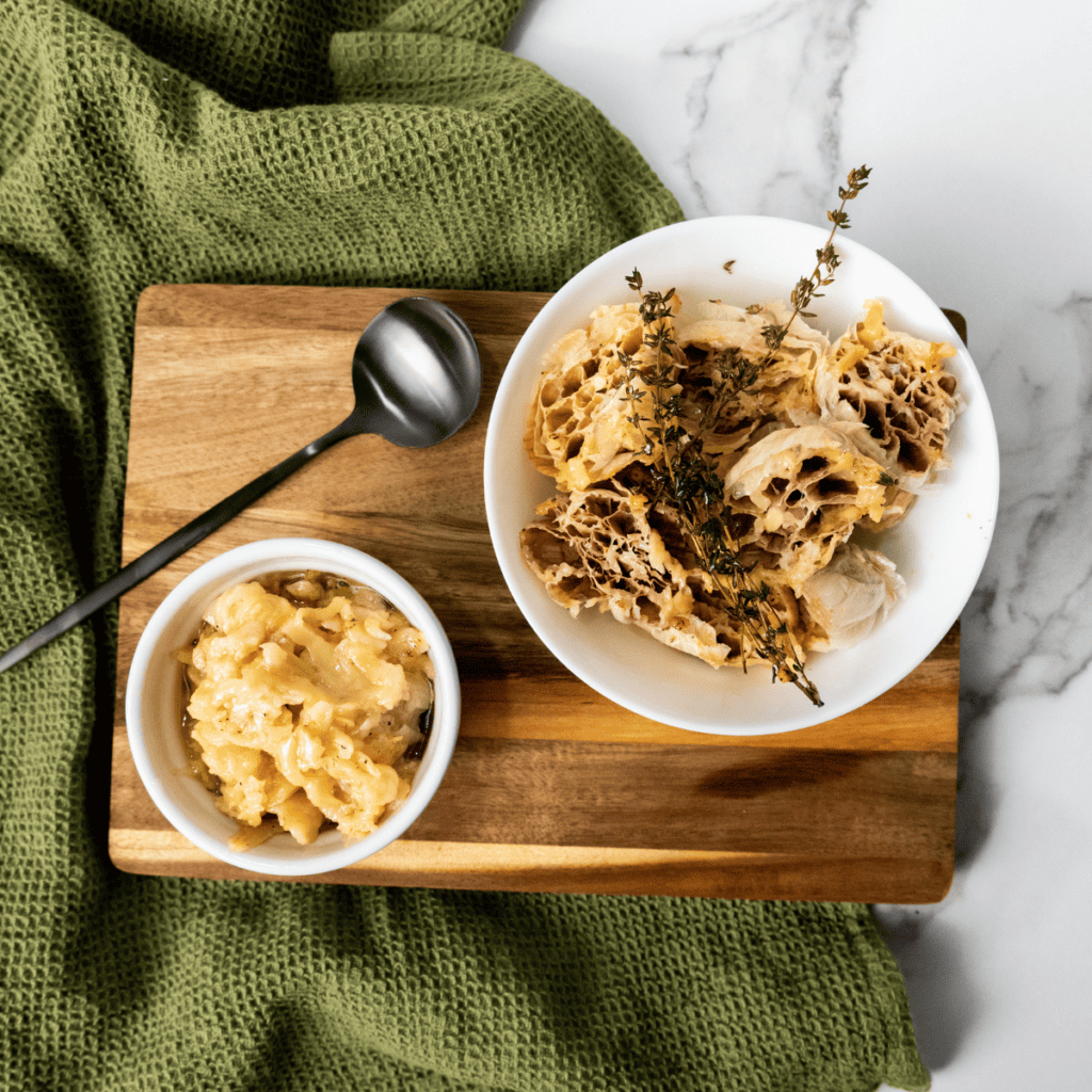Dish with garlic and oil placed in air fryer basket, set to cook until golden and soft