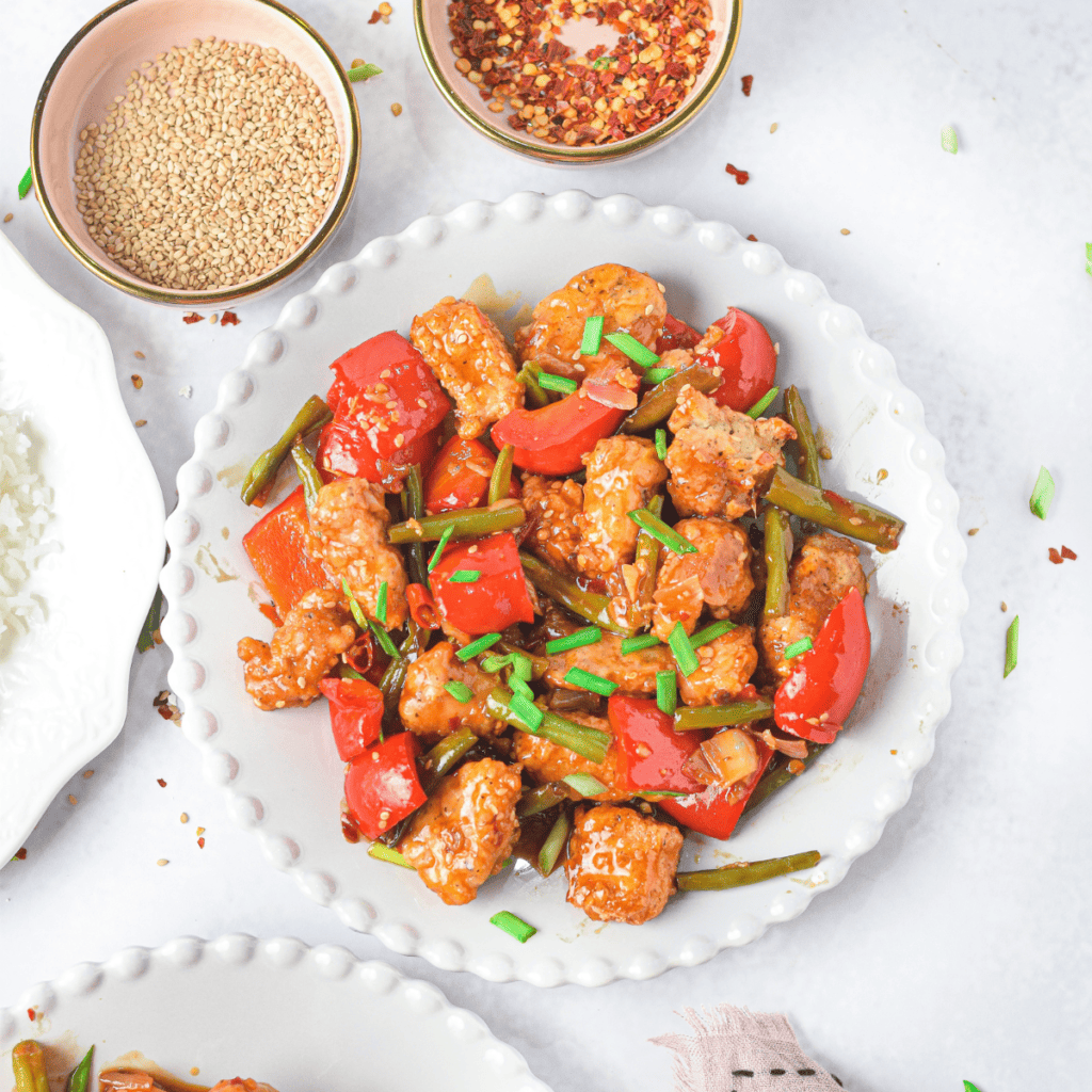 "Golden brown chicken bites fresh from the air fryer served with honey garlic glaze."