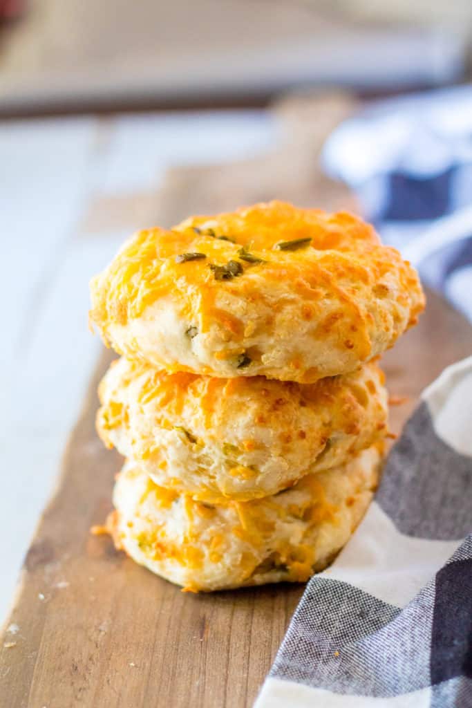 Close-up of keto jalapeno cheddar bagels showing the vibrant jalapeno and cheese topping