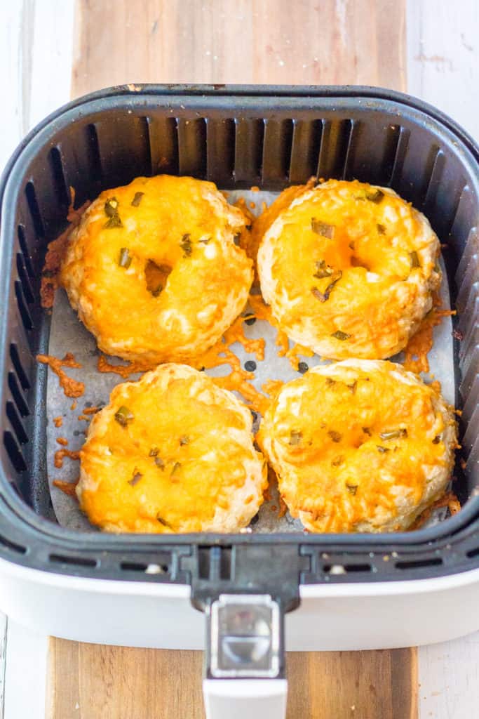 Air frying the jalapeno low-carb bagels until they are golden brown and crispy