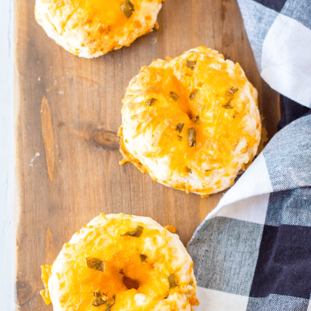 Air Fryer Keto Jalapeno Cheddar Bagels with a golden crust and spicy jalapeno slices