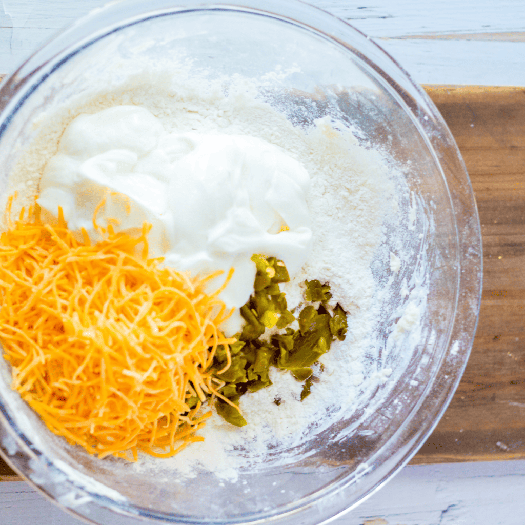Mixing low-carb bagel dough ingredients in a bowl to form a uniform mixture