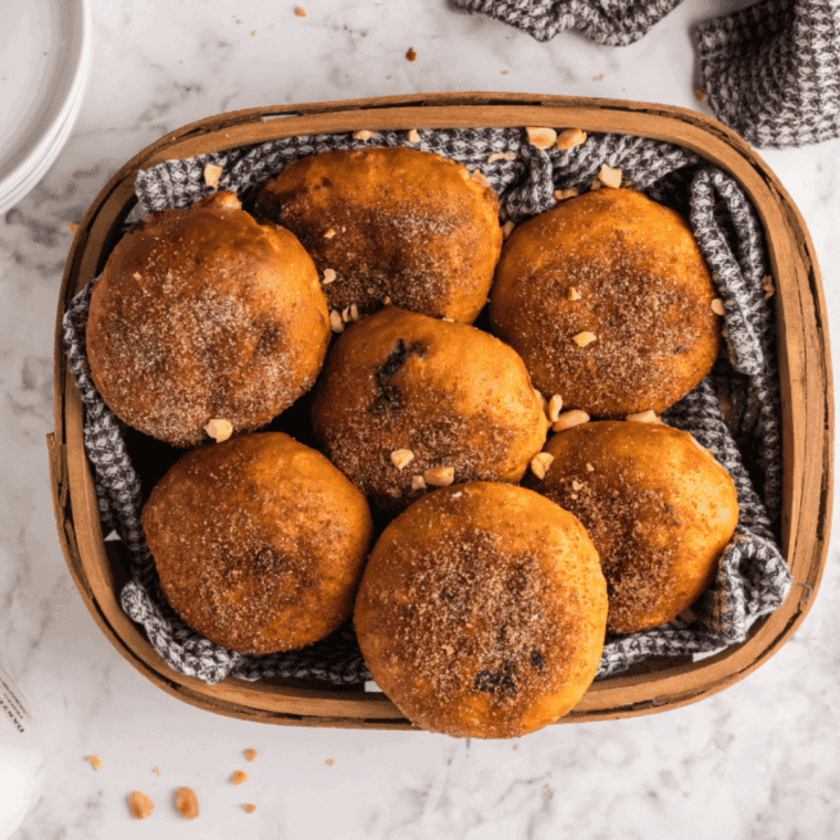 Air Fryer Peanut Butter and Jelly Doughnuts with a crispy golden exterior and a warm, gooey peanut butter and jelly filling.