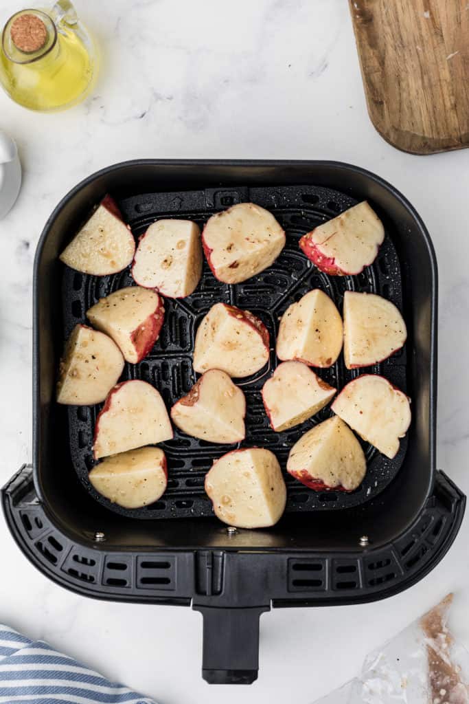  Prep the Potatoes:

Wash and scrub the potatoes to remove any dirt or debris. You can peel them if you prefer, but leaving the skin on adds texture and flavor. Cut the potatoes into evenly-sized pieces, typically around 1-inch cubes.
2. Season the Potatoes:

In a large bowl, combine the potato cubes with olive oil, salt, black pepper, garlic powder, and paprika. Use your hands or a spoon to toss the potatoes, ensuring they are evenly coated with the seasonings. Feel free to add any optional seasonings or herbs at this stage for extra flavor.
3. Preheat the Instant Pot Air Fryer:

Place the Instant Pot Air Fryer Lid on your Instant Pot and preheat it according to the manufacturer's instructions. This usually involves selecting the air fryer function and setting the temperature.
4. Arrange the Potatoes:

Spread the seasoned potato cubes in a single layer in the air fryer basket. Avoid overcrowding, as this can hinder proper crisping. If needed, cook them in batches.
5. Air Fry the Potatoes:

Set the Instant Pot to air fry mode at a temperature of around 380-400°F (190-200°C). Cook the potatoes for about 20-25 minutes, flipping them halfway through to ensure even browning. Cooking times may vary based on your specific appliance and the size of the potato cubes.
6. Check for Doneness:

The roasted potatoes are done when they are crispy and golden brown on the outside, and tender on the inside. Pierce them with a fork or knife to check for doneness.
7. Optional: Garnish and Serve:

Once the potatoes are perfectly roasted, you can garnish them with freshly chopped herbs, grated Parmesan cheese, or a sprinkle of lemon zest for added flavor and presentation.
8. Serve Hot:

Transfer your Instant Pot Air Fryer Roasted Potatoes to a serving dish and enjoy them hot as a side dish, brunch addition, or snack.
These roasted potatoes are versatile and make a