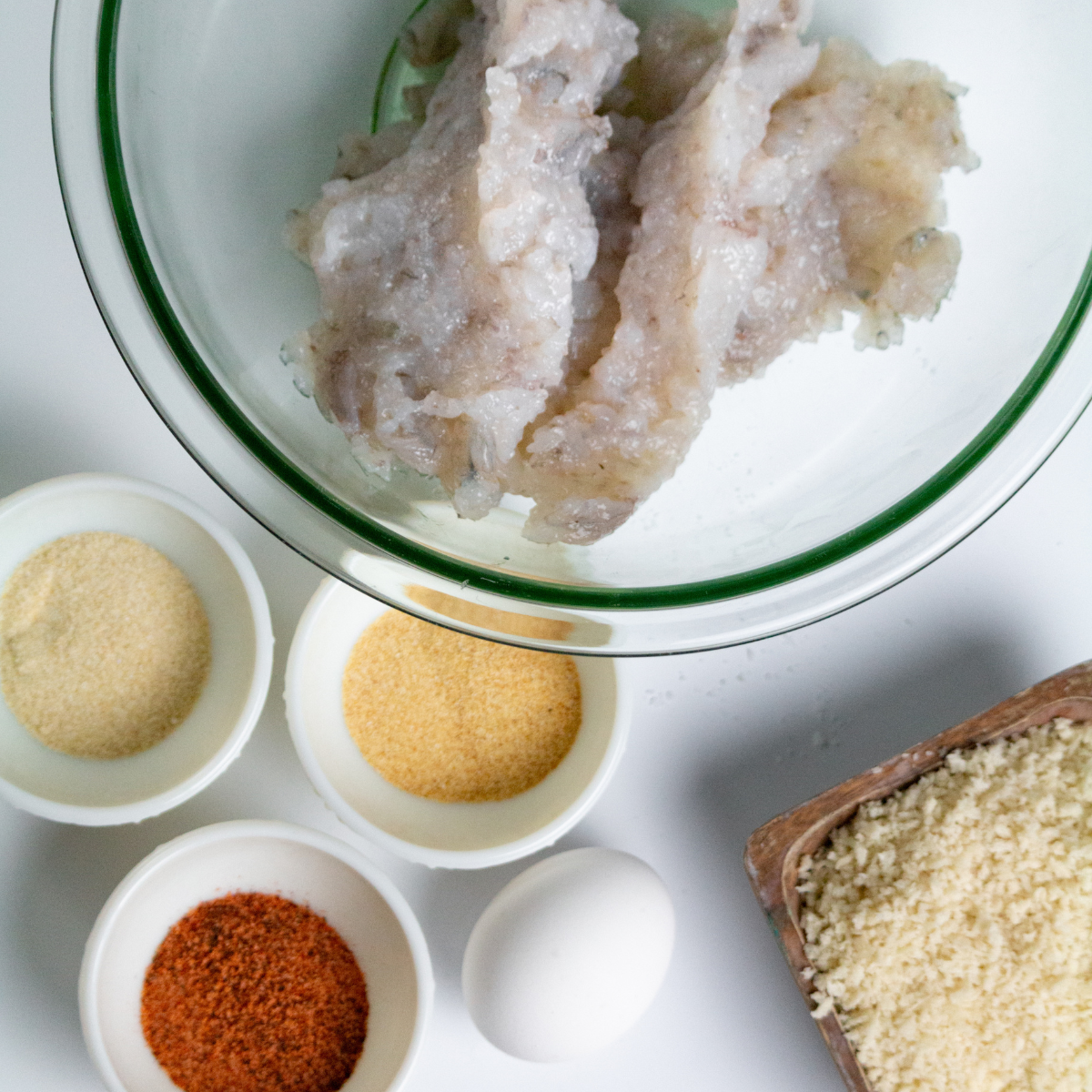 Ingredients needed for shrimp burger on kitchen counter.
