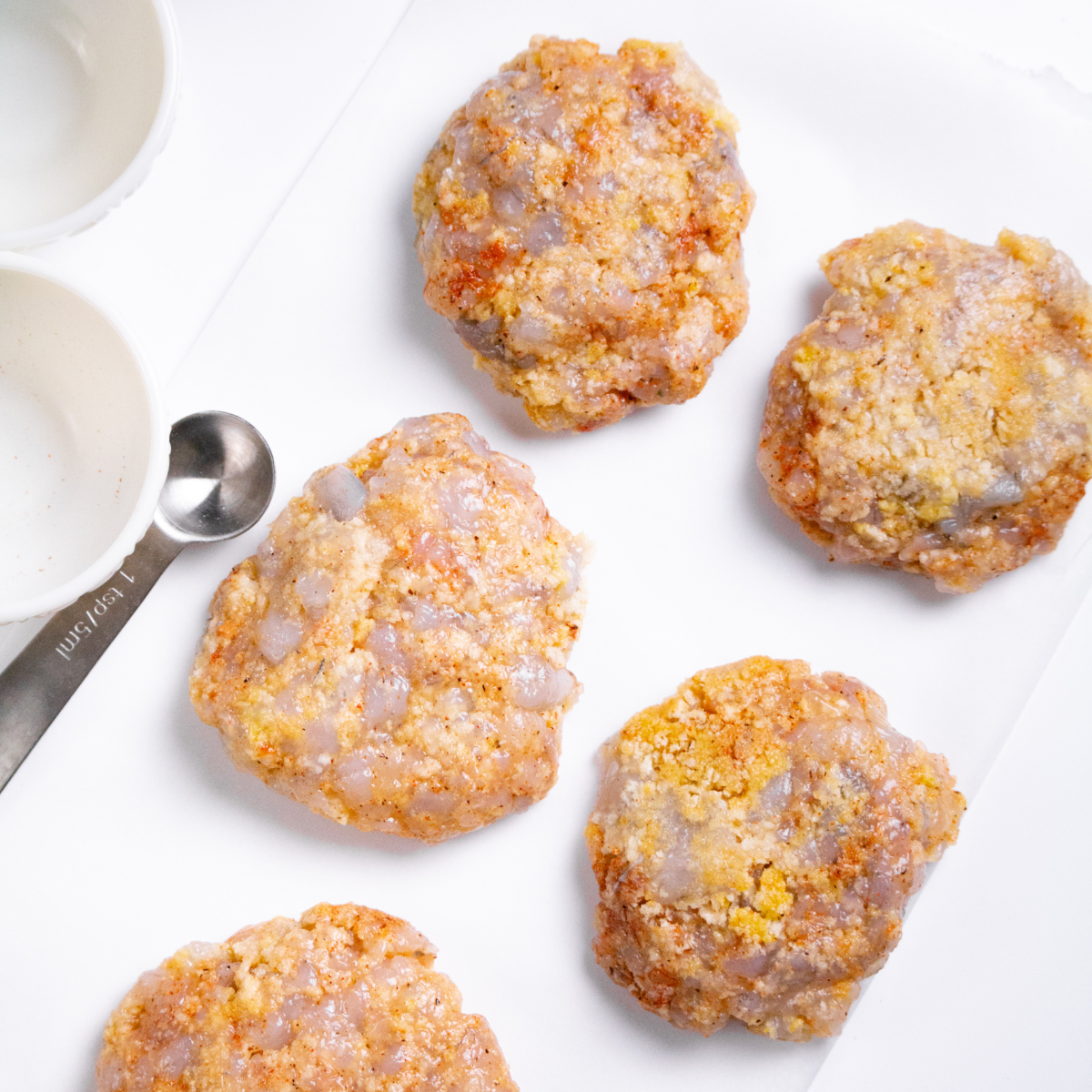 Shape the shrimp patties, and place them on parchment paper.
