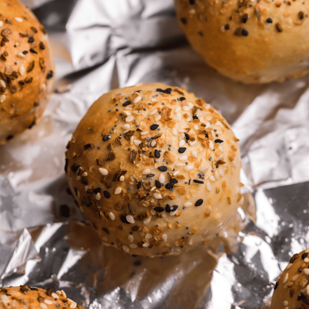 10:44 AM
Claude responded: Golden-brown air fryer 2-ingredient bagel bites topped with everything bagel seasoning, stacked on a wire cooling rack.
Golden-brown air fryer 2-ingredient bagel bites topped with everything bagel seasoning, stacked on a wire cooling rack.