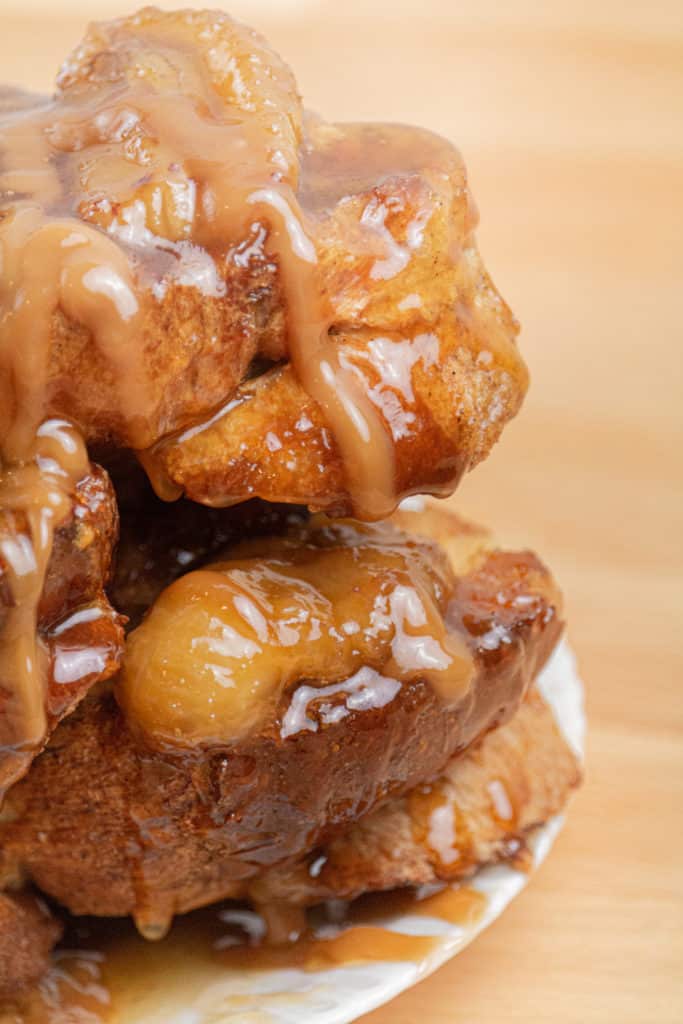 "Delicious Air Fryer Bananas Foster French Toast served on a plate with a side of fresh fruit."