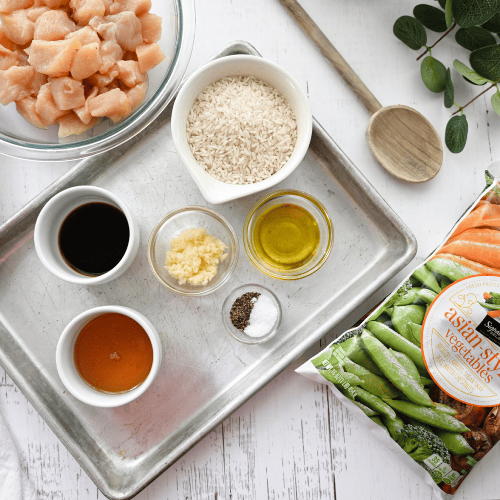 Diced raw chicken seasoned with salt and pepper on a cutting board