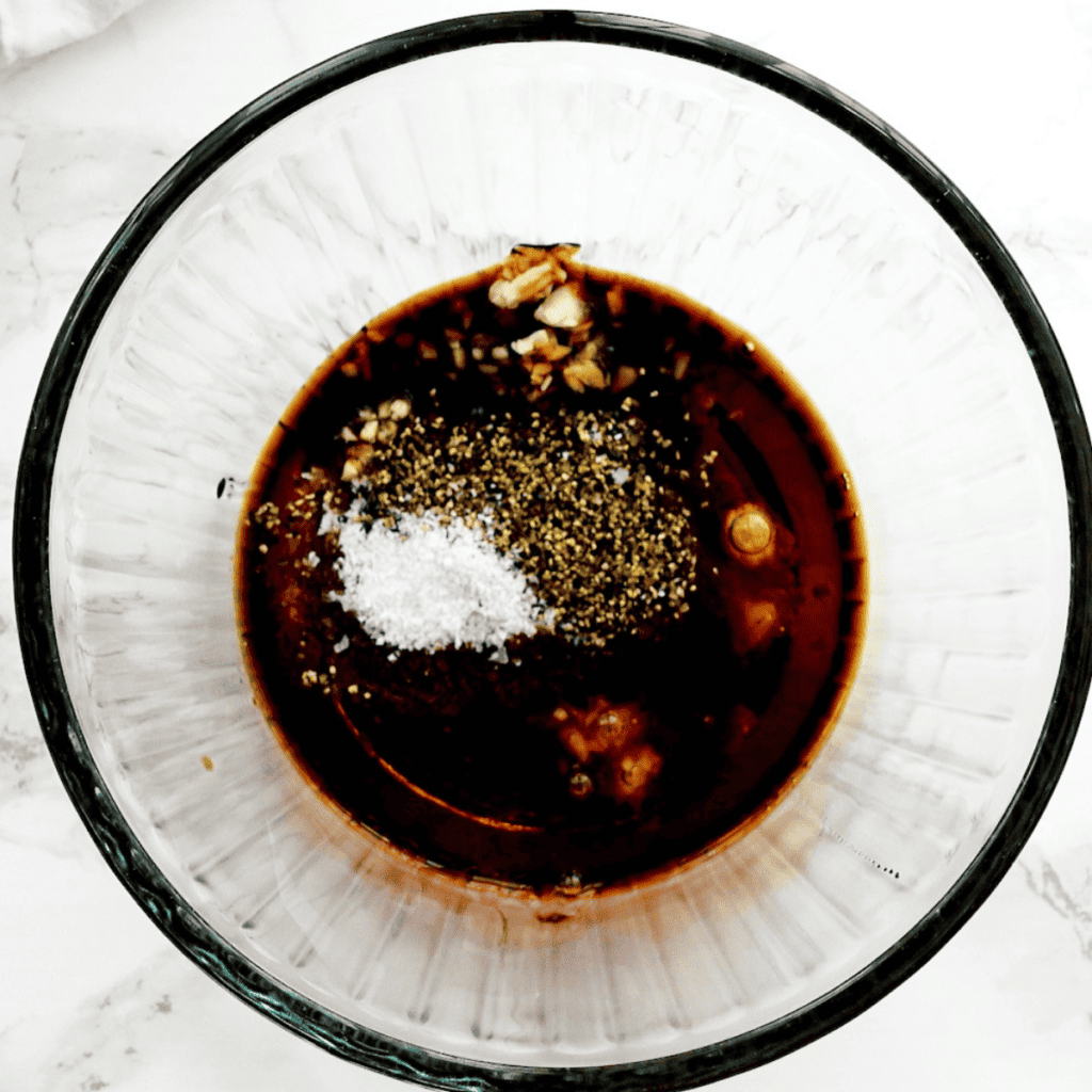 Stir-fry sauce ingredients whisked together in a glass mixing bowl